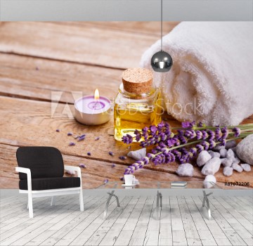 Bild på Spa still life with lavender oil white towel and perfumed candle on natural wood